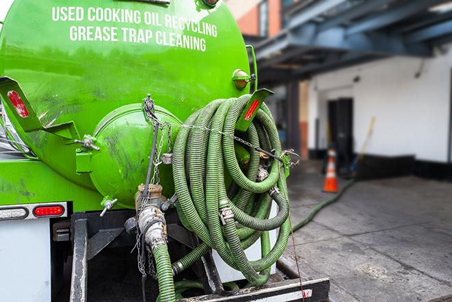 a large industrial grease trap being pumped out in Alpine CA